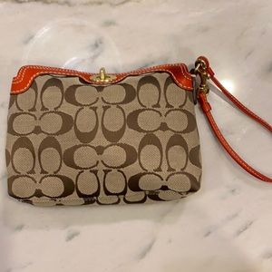Coach signature turnlock wristlet in logo & red